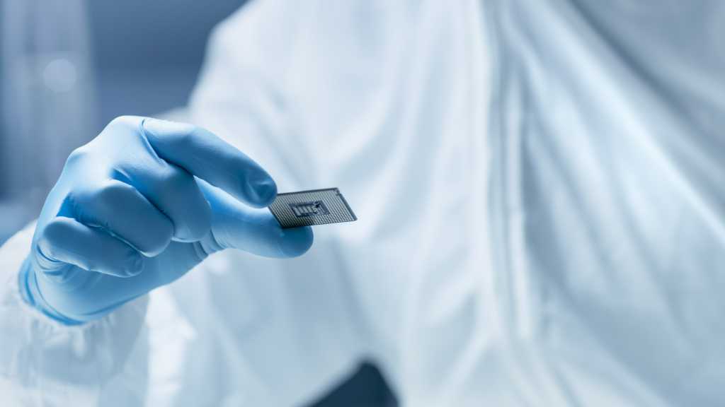 Scientist holding a microchip