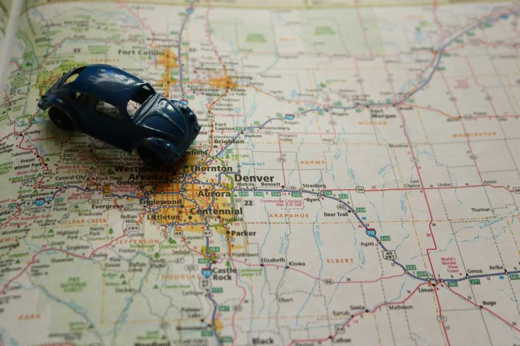 Toy car on top of a roadmap